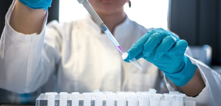 female scientist in a lab wearing a lab coat